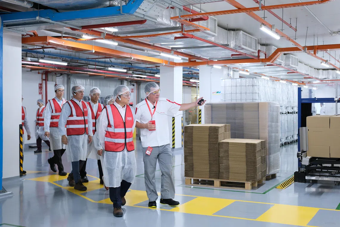 Deputy Prime Minister Gan Kim Yong visits Coca-Cola's regional beverage concentrate plant on Oct 22. 