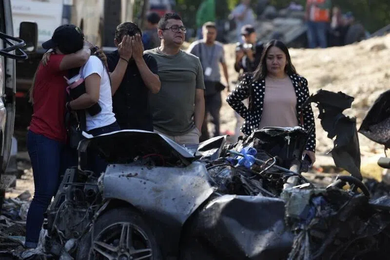 Relatives of the victims at the scene of the attack on the Pan-American Highway in Cajibio, Colombia, on April 26.
