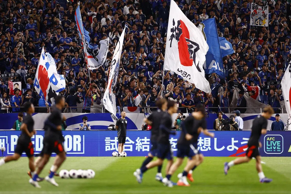 Japan's supporters making it a red-hot cauldron at the Saitama Stadium ahead of their teams' World Cup qualifier against Australia.