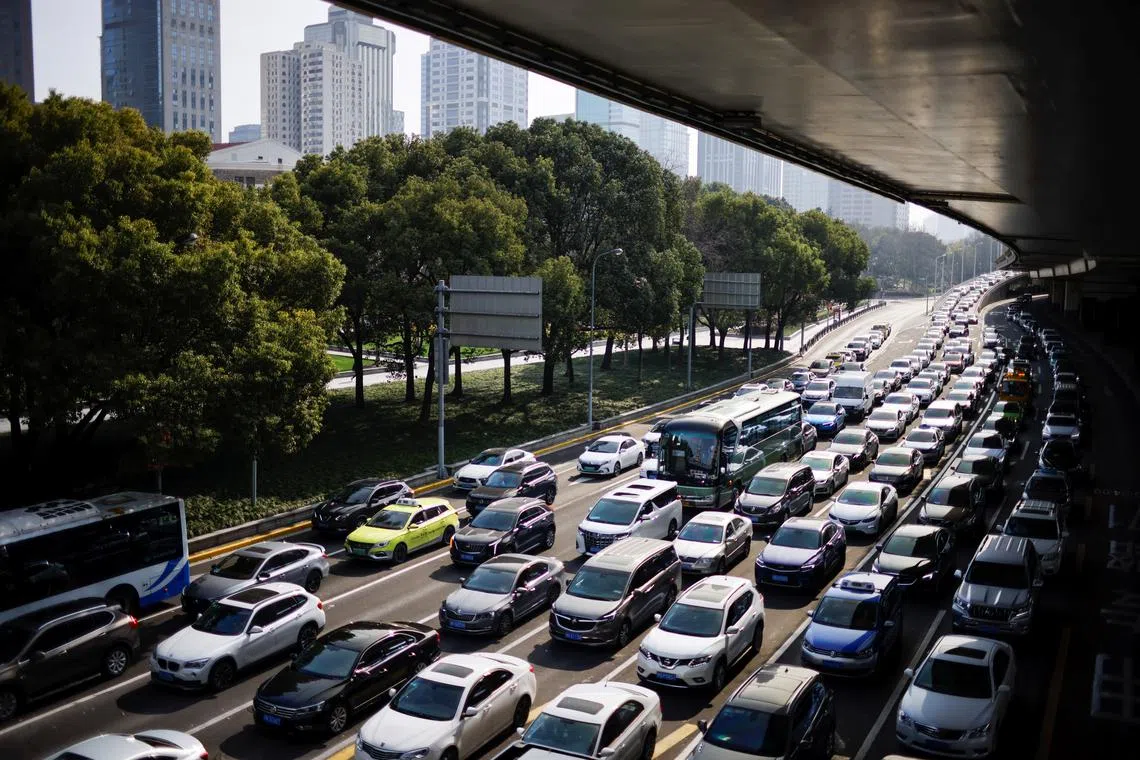 Cars wait in traffic in Shanghai, China March 10, 2021. Picture taken March 10, 2021. REUTERS/Aly Song/ File Photo