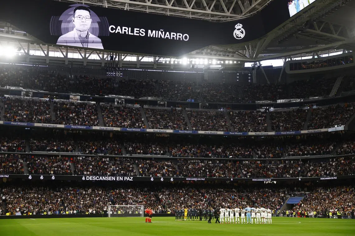 FILE PHOTO: Soccer Football - LaLiga - Real Madrid v Rayo Vallecano - Santiago Bernabeu, Madrid, Spain - March 9, 2025 General view during a minutes silence in memory of FC Barcelona doctor Carles Minarro Garcia before the match REUTERS/Susana Vera/File Photo