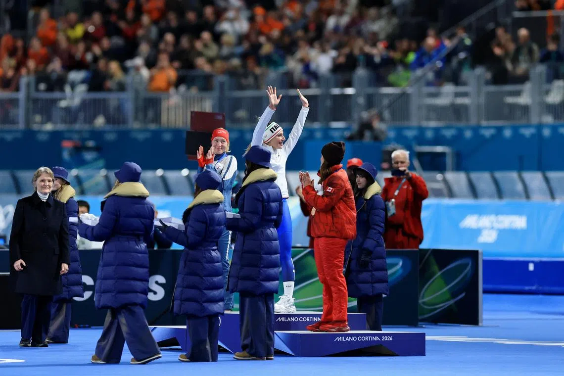 Feb 7, 2026; Milan, Italy; Gold medalist Francesca Lollobrigida of Italy stands on the podium with silver medalist Ragne Wiklund of Norway and bronze medalist Valerie Maltais of Canada during the medal ceremony for the women's speed skating 3000m during the Milano Cortina 2026 Olympic Winter Games at Milano Speed Skating Stadium. Mandatory Credit: Katie Stratman-Imagn Images