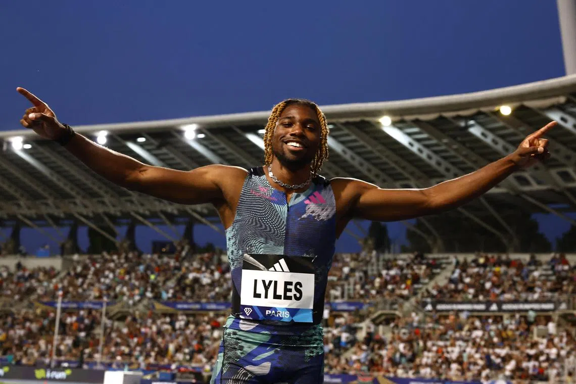 Noah Lyles celebrates winning the men's 100m at the Charlety Stadium in Paris on June 9, 2023