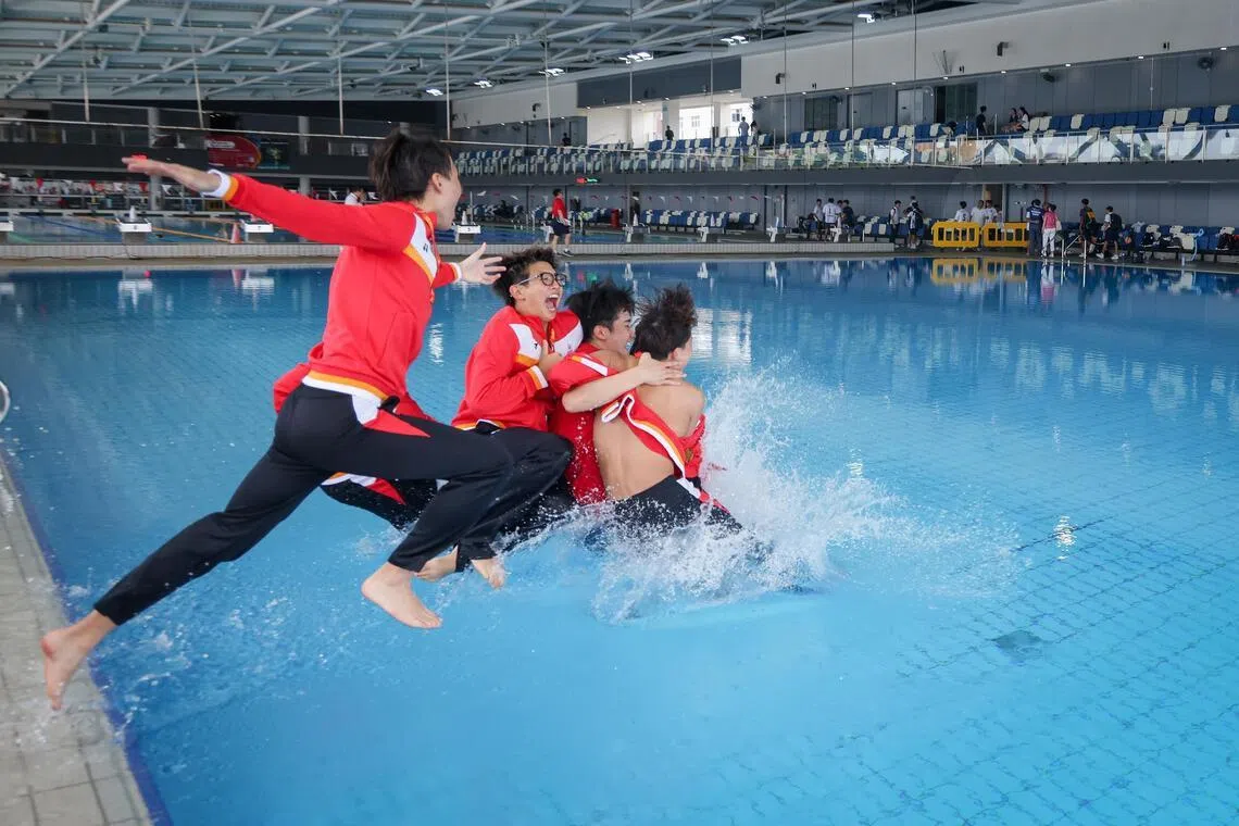Singapore Sports School players and coach Rio Shirahama celebrate after SSP-OSS defeated ACS (Independent) in the National School Games B Div Boys' Water Polo Final At Our Tampines Hub on March 30, 2026. 