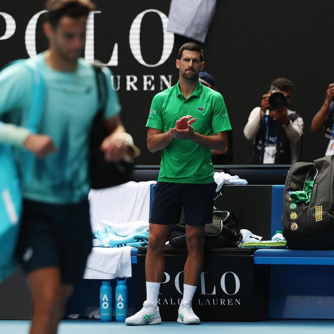 Novak Djokovic respectfully applauds his rival Lorenzo Musetti who had to retire during their quarter-final match at the Australian Open. 
