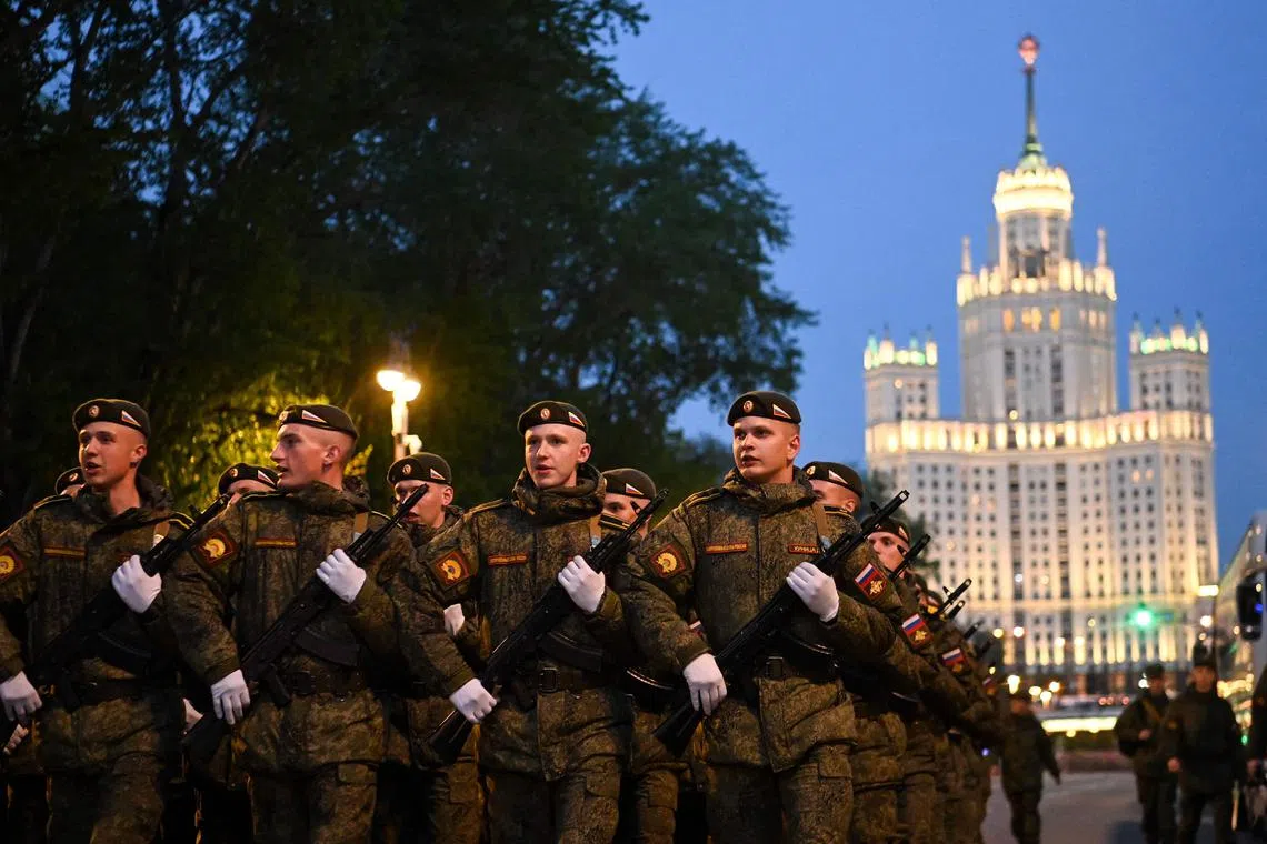 Russian servicemen march as they arrive to the Victory Day military parade rehearsal in central Moscow.