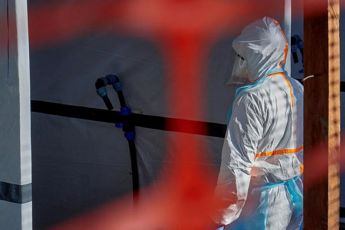A health worker is dressed up in personal protective equipment (PPE) at the Evangelical Medical Center, one of the facilities at the forefront of the response to the Ebola outbreak, as agencies intensify efforts to contain a new Ebola outbreak caused by the Bundibugyo virus strain, in Bunia, Ituri province, Democratic Republic of Congo, May 31, 2026. REUTERS/Gradel Muyisa Mumbere