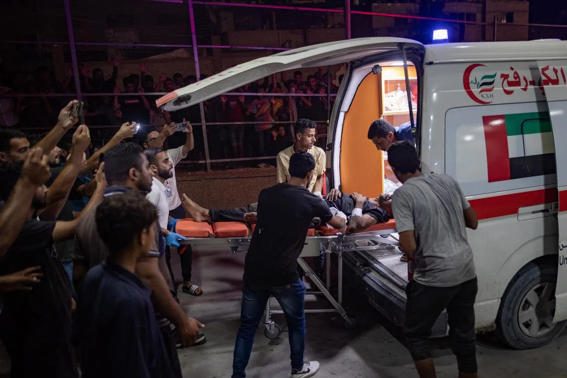 Palestinians transport the wounded to Nasser Hospital in Khan Yunis, on June 27, 2024.