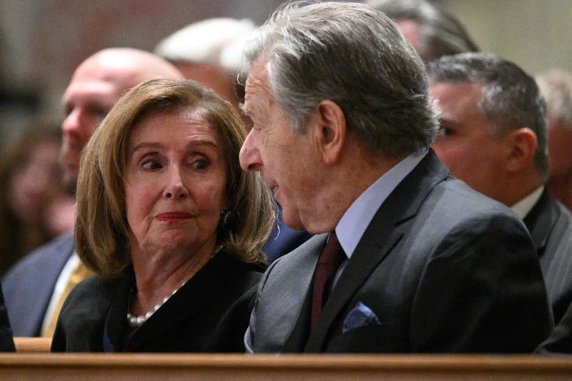 Former Speaker of the House Nancy Pelosi sits with her husband Paul Pelosi on Oct 16.