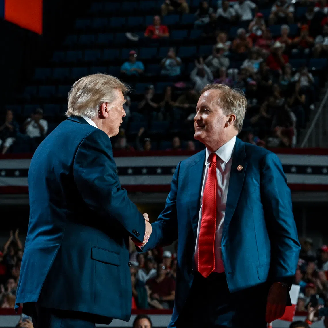 US President Donald Trump (left) is joined by Ken Paxton, the Texas attorney-general and Republican candidate for Senate, at a campaign rally on Oct 7 in San Antonio, Texas.