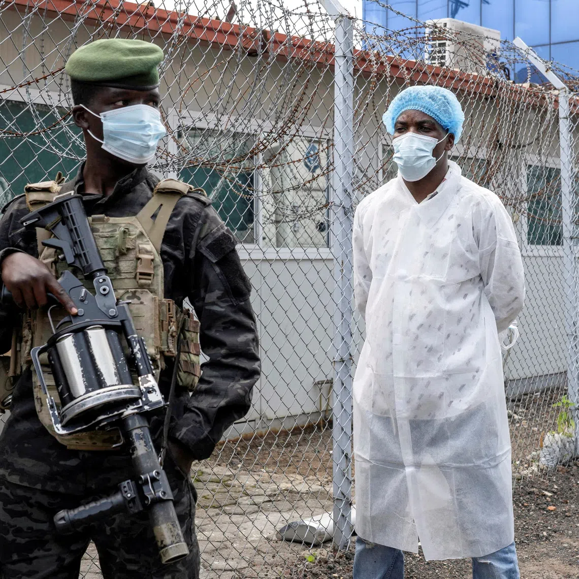 FILE PHOTO: A member of the M23 rebel group stands guard as provincial authorities visit the Rodolphe Merieux Laboratory, National Biomedical Research Institute (INRB), where samples from suspected Ebola cases are tested, as part of the response to the epidemic in Goma, North Kivu province of the Democratic Republic of Congo, May 19, 2026. REUTERS/Arlette Bashizi/File Photo