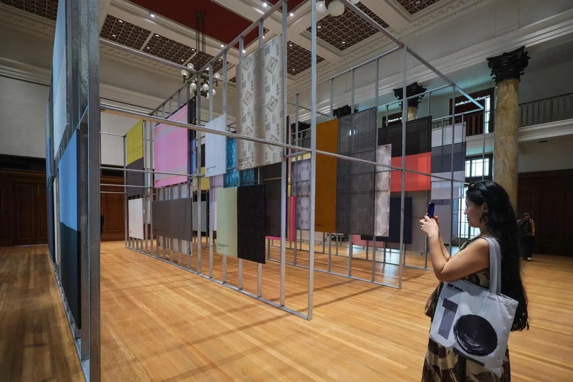 Japanese contemporary artist Fujii Hikaru’s installation of stretched fabrics are ghostly remnants of 54 wartime propaganda paintings that depict South-east Asia.
