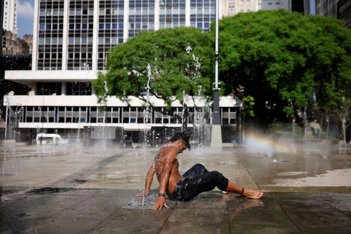 Homeless Danilo da Silva uses a fountain to cool off and wash himself, during a heatwave in the Anhangabau Valley, in the centre of Sao Paulo, Brazil September 22, 2023. REUTERS/Amanda Perobelli/File Photo