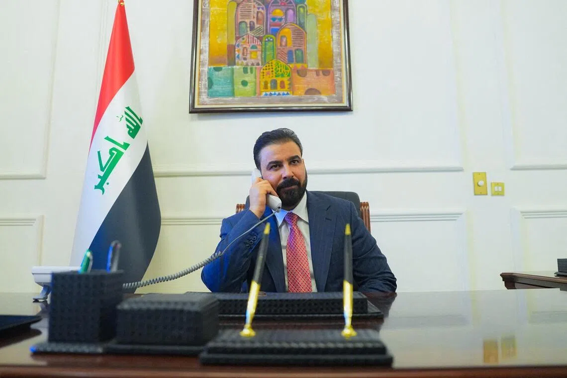 New Iraqi Prime Minister designate Ali al-Zaidi, uses a phone at his office in Baghdad, Iraq, on April 28.