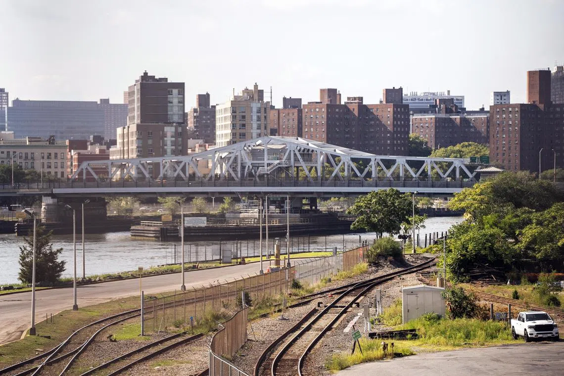 The Third Avenue Bridge, connecting Manhattan, left, with the Bronx over the Harlem River, in New York on Aug. 28, 2024. Earlier this summer, extreme heat caused a joint to expand and the bridge was stuck in its open position for hours. (Graham Dickie/The New York Times)