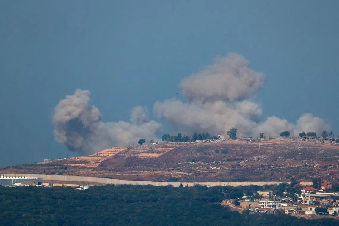 Smoke billows over southern Lebanon, amid ongoing hostilities between Hezbollah and Israeli forces, as seen from northern Israel, October 28, 2024. REUTERS/Gonzalo Fuentes