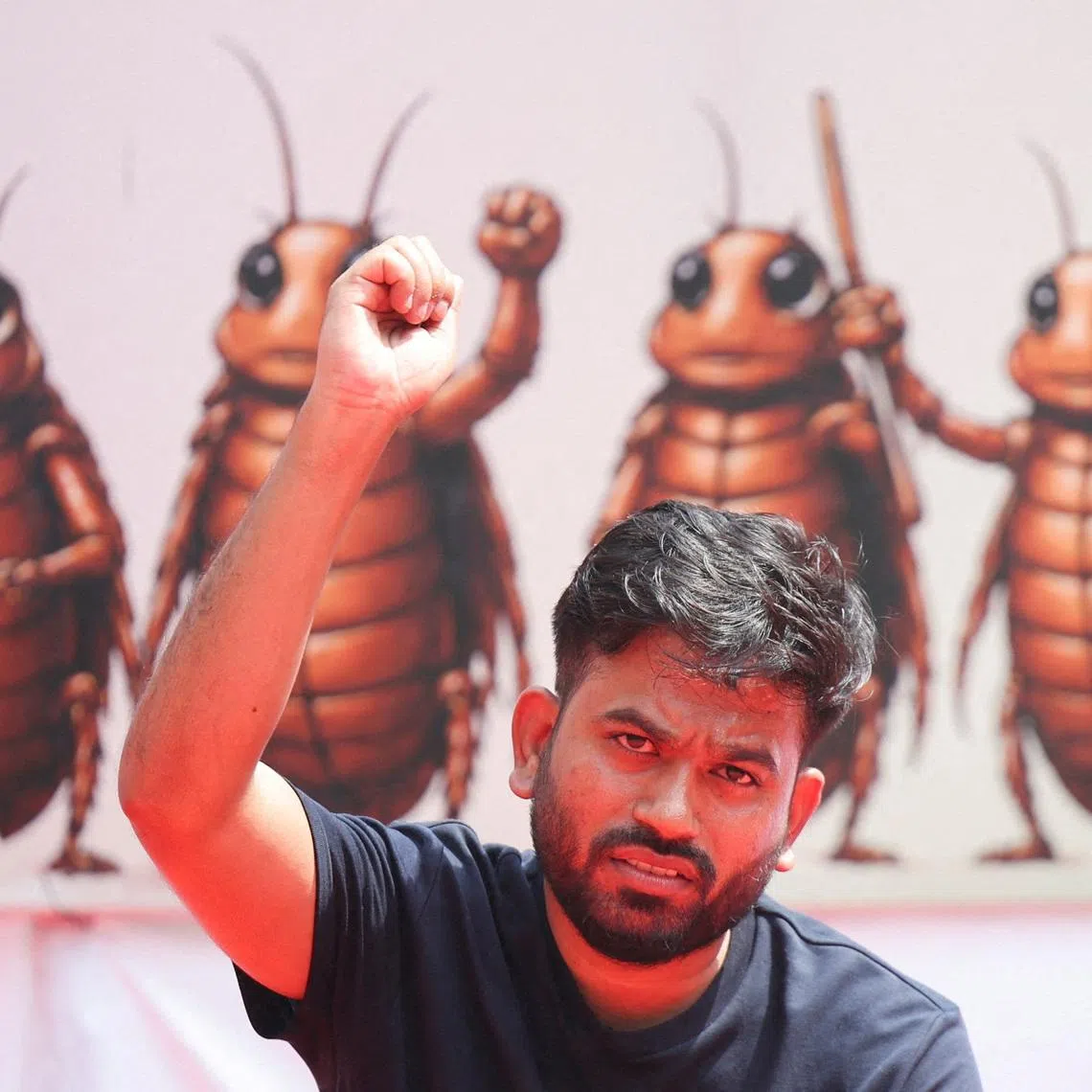 FILE PHOTO: Abhijeet Dipke, head of the Cockroach Janta Party (CJP), gestures to the supporters of the CJP during a sit-in protest demanding the resignation of Indian Education Minister Dharmendra Pradhan, in New Delhi, India, June 20, 2026. REUTERS/Anushree Fadnavis/File Photo