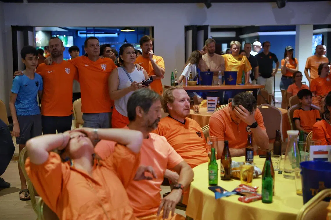 Dutch fans reacting to their team’s saved penalty in the shoot-out during the live screening of World Cup quarter-final match between the Netherlands and Argentina at Hollandse Club on Friday. 