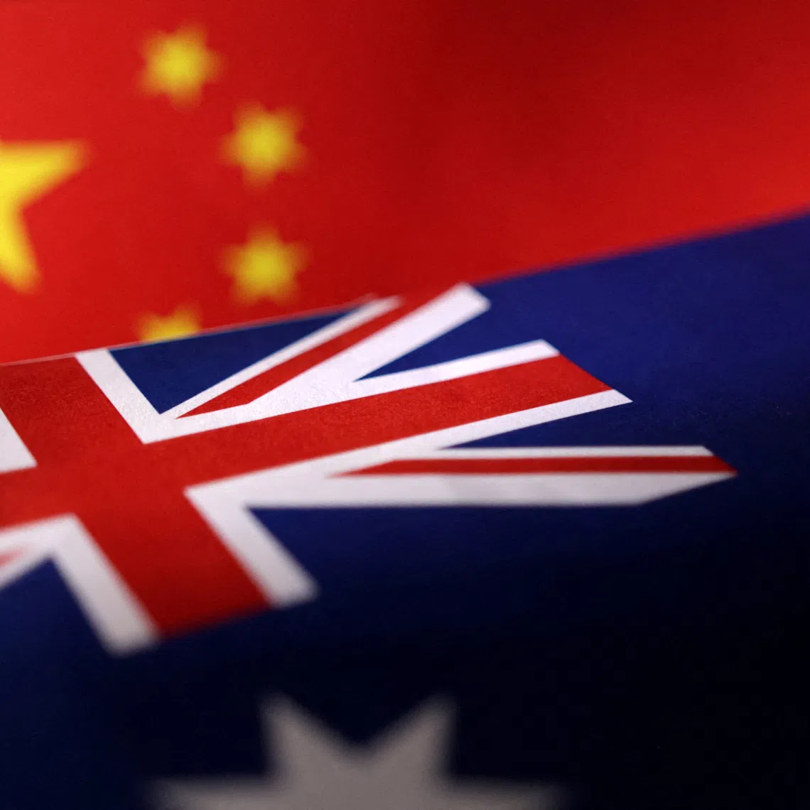 Printed Chinese and Australian flags are seen in this illustration, July 21, 2022. REUTERS/Dado Ruvic/Illustration