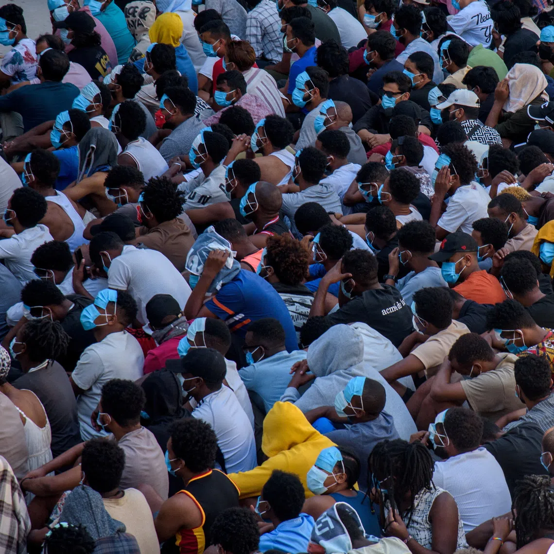 FILE PHOTO: Victims of scam centers who were tricked or trafficked into working in Myanmar, are stuck in limbo at a compound inside the KK Park, a fraud factory, and a human trafficking hub on the border with Thailand-Myanmar after a multinational crackdown on the compounds run by criminal gangs, operated by the Karen Border Guard Force (BGF) in Myawaddy, Myanmar, February 26, 2025. REUTERS/Stringer/File Photo