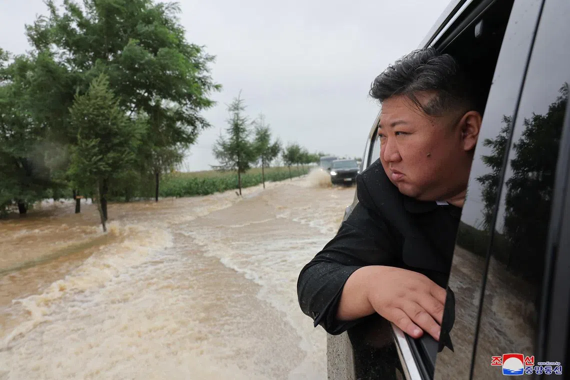 A photo released by the official North Korean Central News Agency (KCNA) shows North Korean leader Kim Jong Un inspecting a flood-hit area in North Phyongan Province, North Korea, on July 28. 