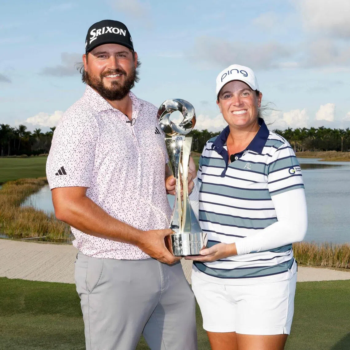 Andrew Novak and Lauren Coughlin of the United States poing with the trophy after winning the Grant Thornton Invitational 2025 at Tiburon Golf Club on Dec 14, 2025, in Naples, Florida. They posted a 28-under 188 for the three-round event.