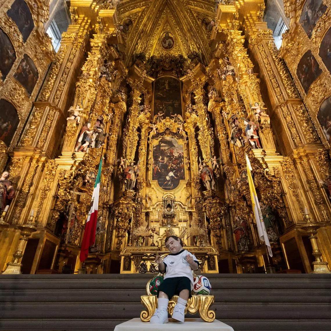 A baby Jesus figurine dressed in the jersey of the Mexico national team is arranged at the Metropolitan Cathedral on June 16.