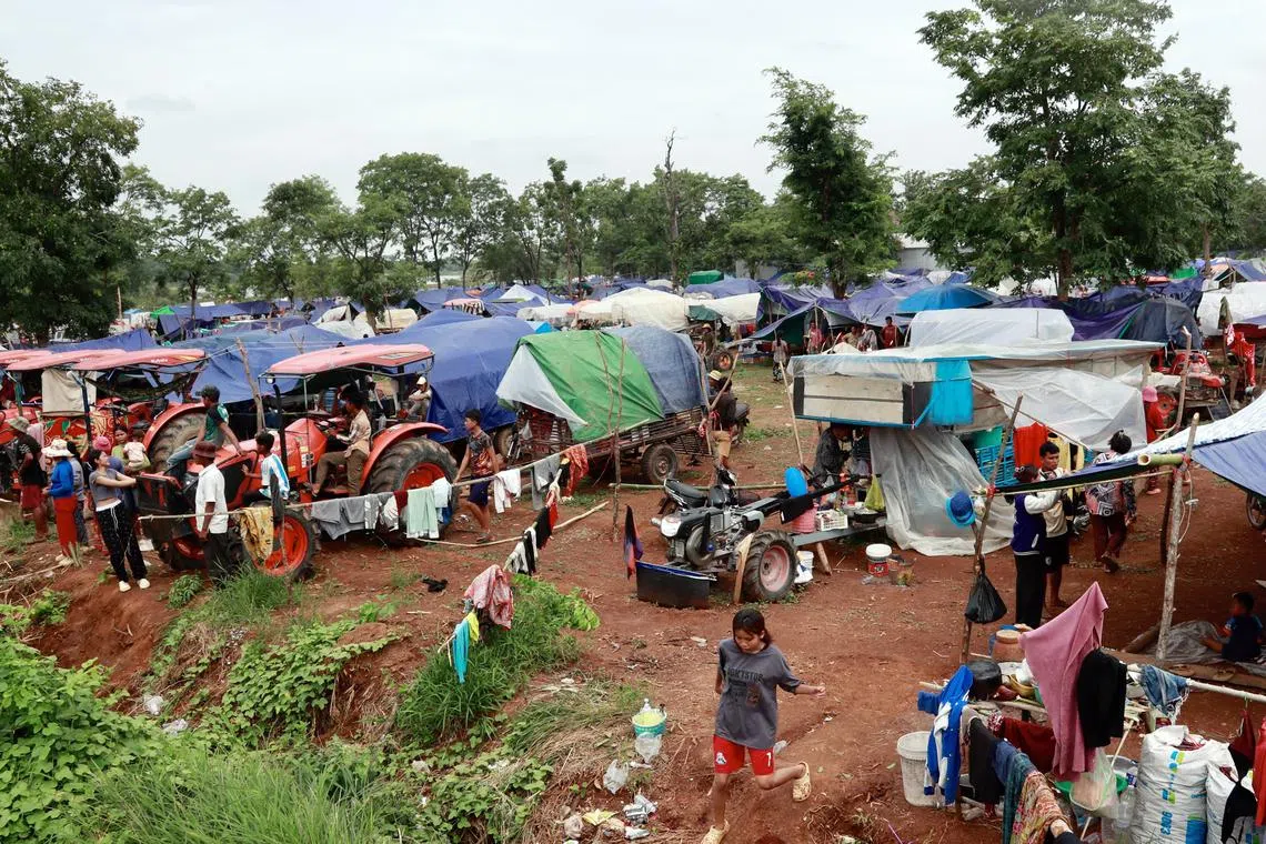 Civilians, displaced amidst clashes along the disputed Thai-Cambodian border, gather at a makeshift camp in the Oddar Meanchey province, northwest of Cambodia, on July 26.