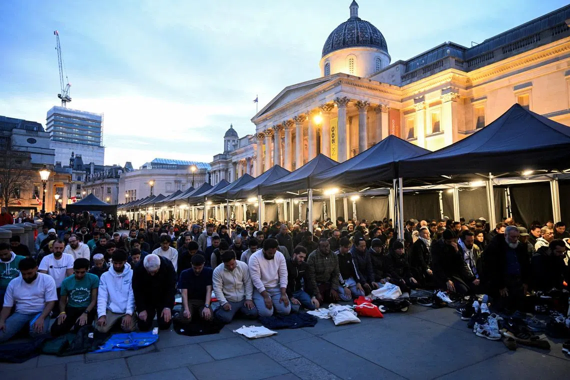 Muslims pray during Open Iftar 2025 organised by the Ramadan Tent Project, at Trafalgar Square in London, Britain, March 29, 2025. REUTERS/Jaimi Joy/File Photo