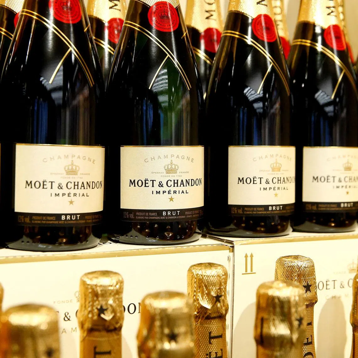 FILE PHOTO: Bottles of French Moet & Chandon champagne are offered at a supermarket of Swiss retail group Coop in Zumikon, Switzerland December 13, 2016.  REUTERS/Arnd Wiegmann
