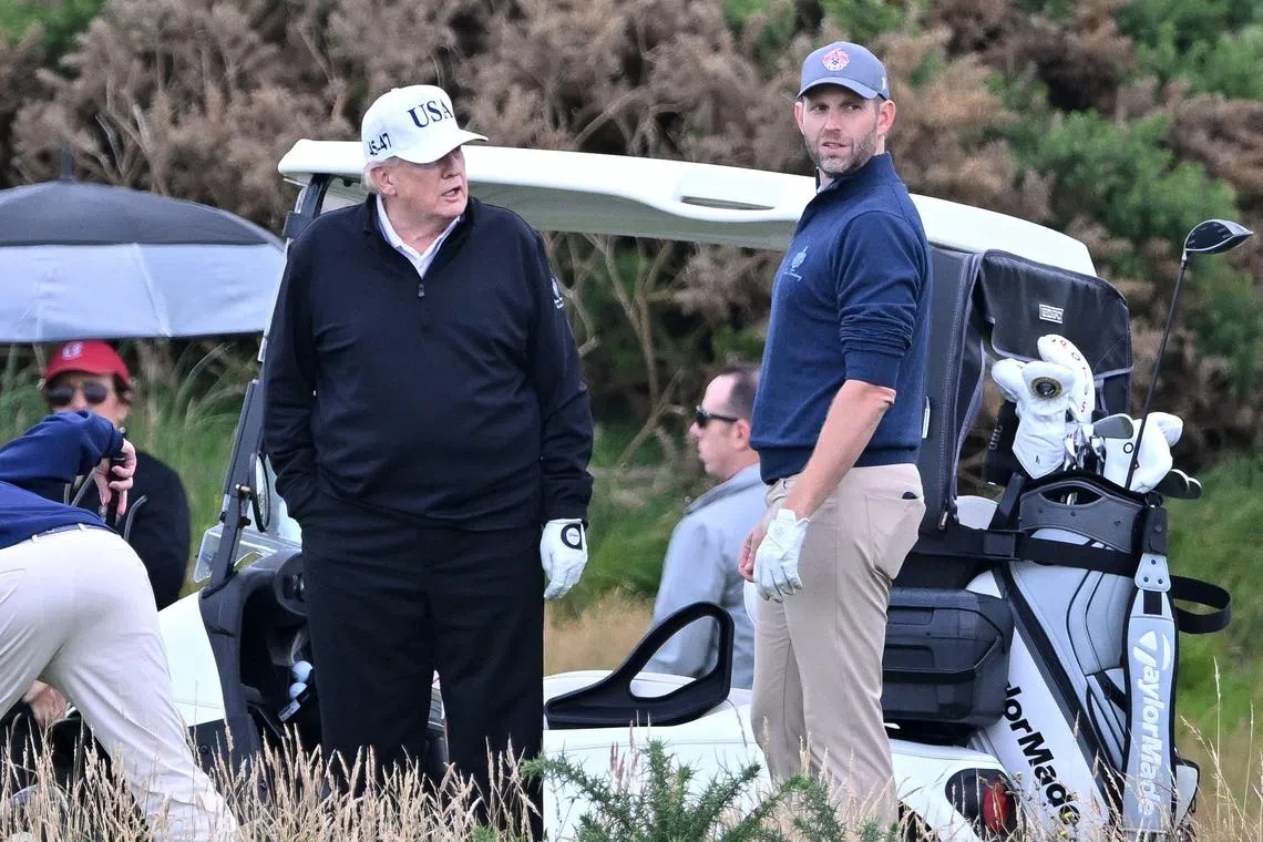 US President Donald Trump (left) and his son Eric at Mr Trump's Turnberry golf resort in Scotland on July 26.
