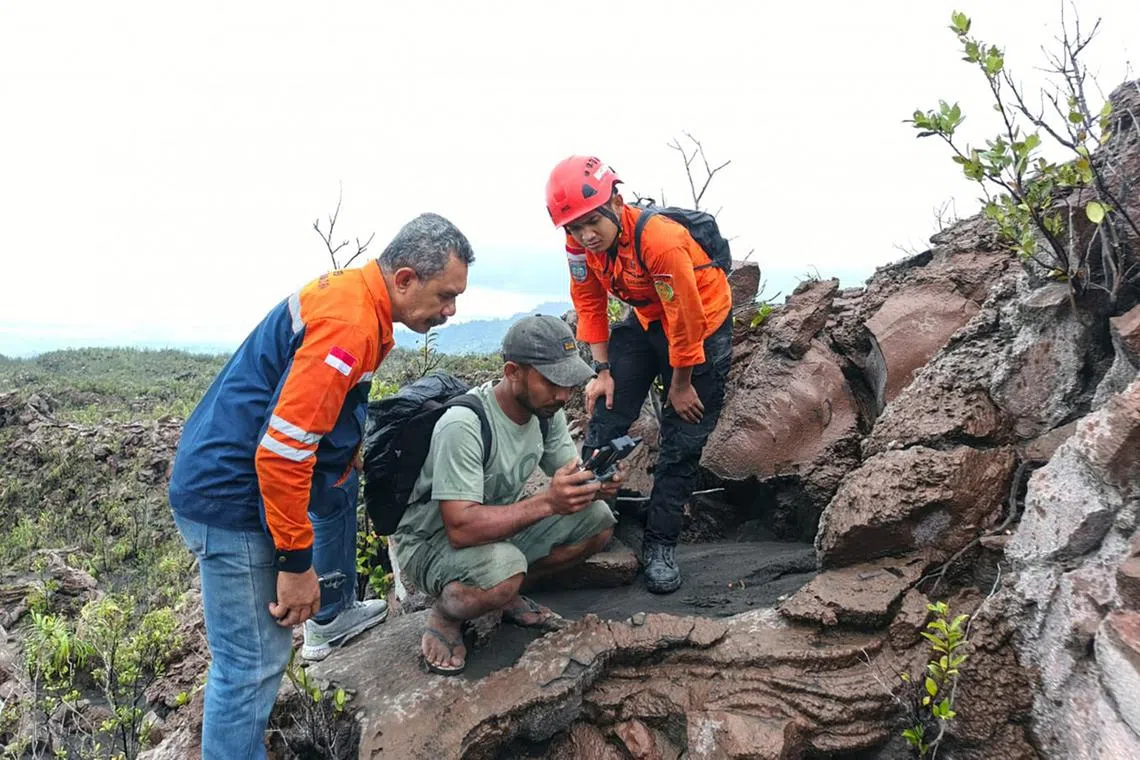 A search and rescue team using a drone to search for missing hikers on May 8.