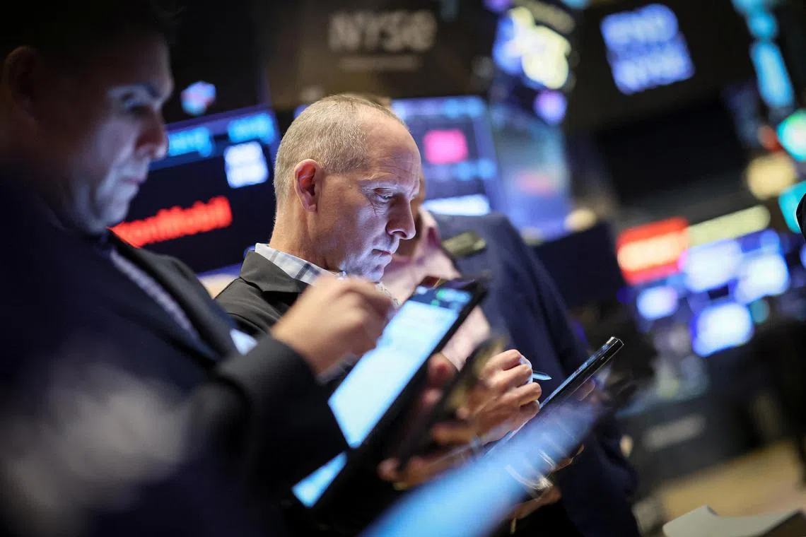 Traders work on the floor of the New York Stock Exchange, in New York City.  
