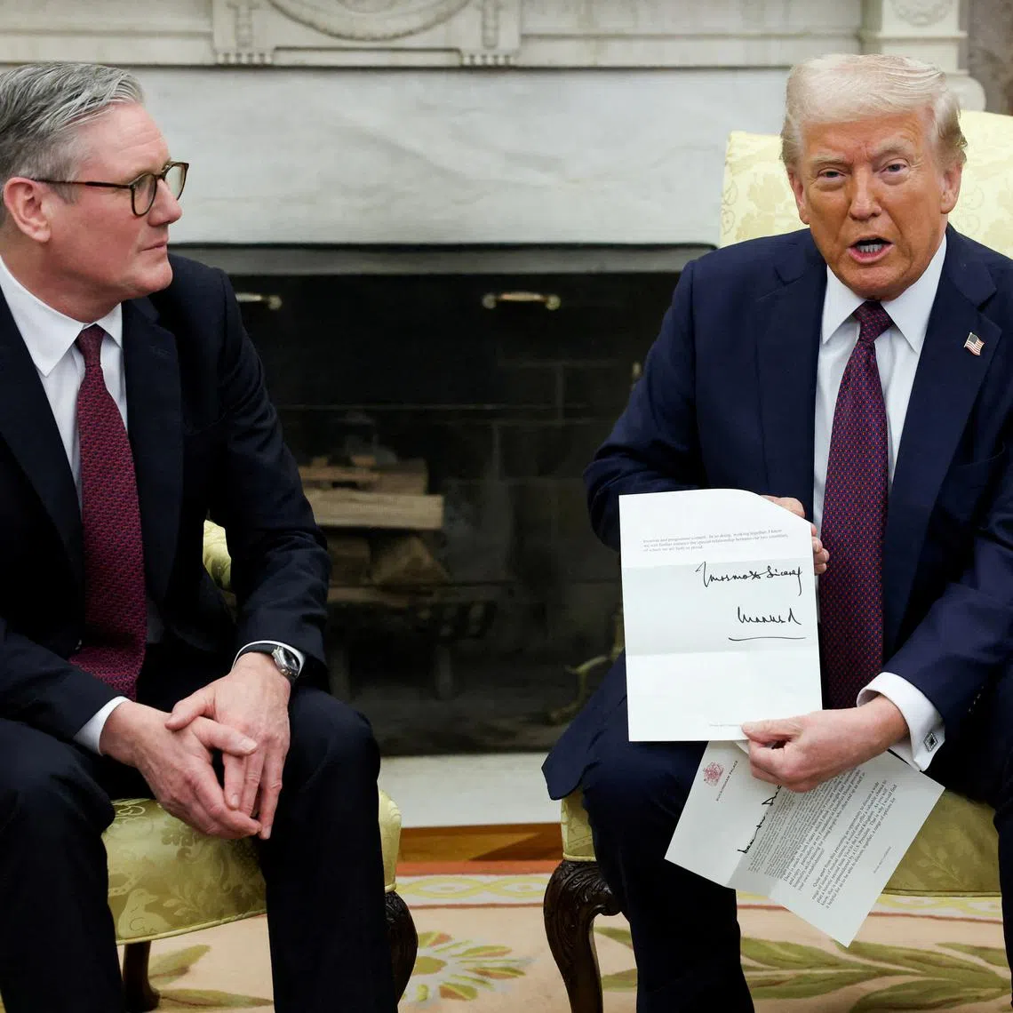 FILE PHOTO: FILE PHOTO: U.S. President Donald Trump holds a letter from Britain's King Charles as he meets with British Prime Minister Keir Starmer in the Oval Office at the White House in Washington, D.C., U.S., February 27, 2025. REUTERS/Kevin Lamarque/File Photo/File Photo