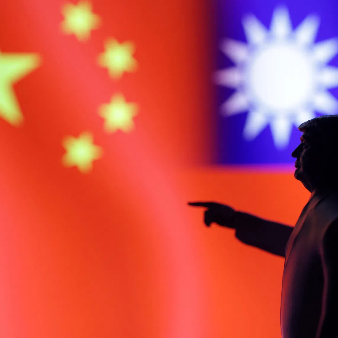 A 3D-printed miniature model depicting U.S. President Donald Trump, Chinese flag and fragment of Taiwanese flag in this illustration taken,  April 17, 2025. REUTERS/Dado Ruvic/Illustration