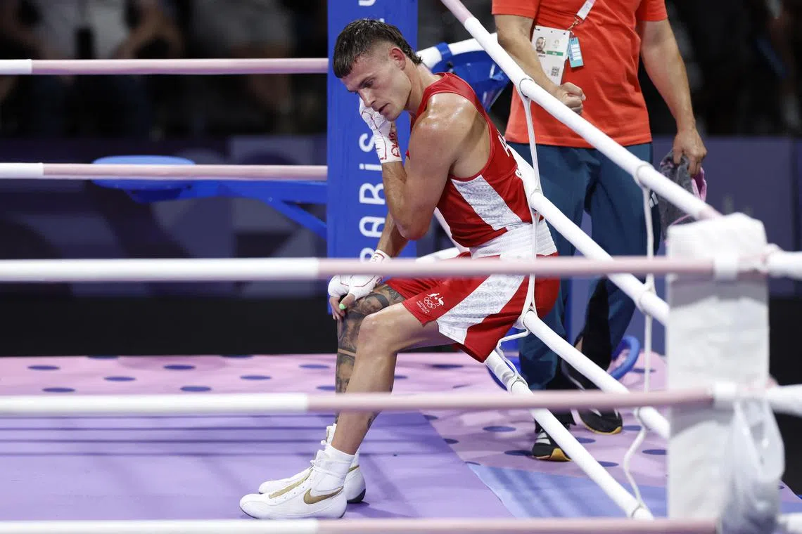 Paris 2024 Olympics - Boxing - Men's 63.5kg - Prelims - Round of 16 - North Paris Arena, Villepinte, France - July 29, 2024. Harry Garside of Australia reacts after losing his fight against Richard Kovacs of Hungary. REUTERS/Peter Cziborra