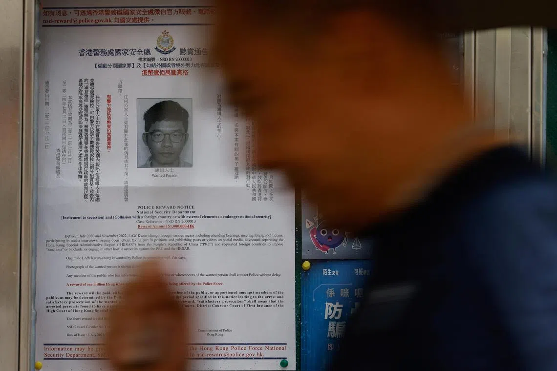 A profile of wanted exiled activist Nathan Law, is seen on a noticeboard outside a police station in Hong Kong on June 12, 2024. 