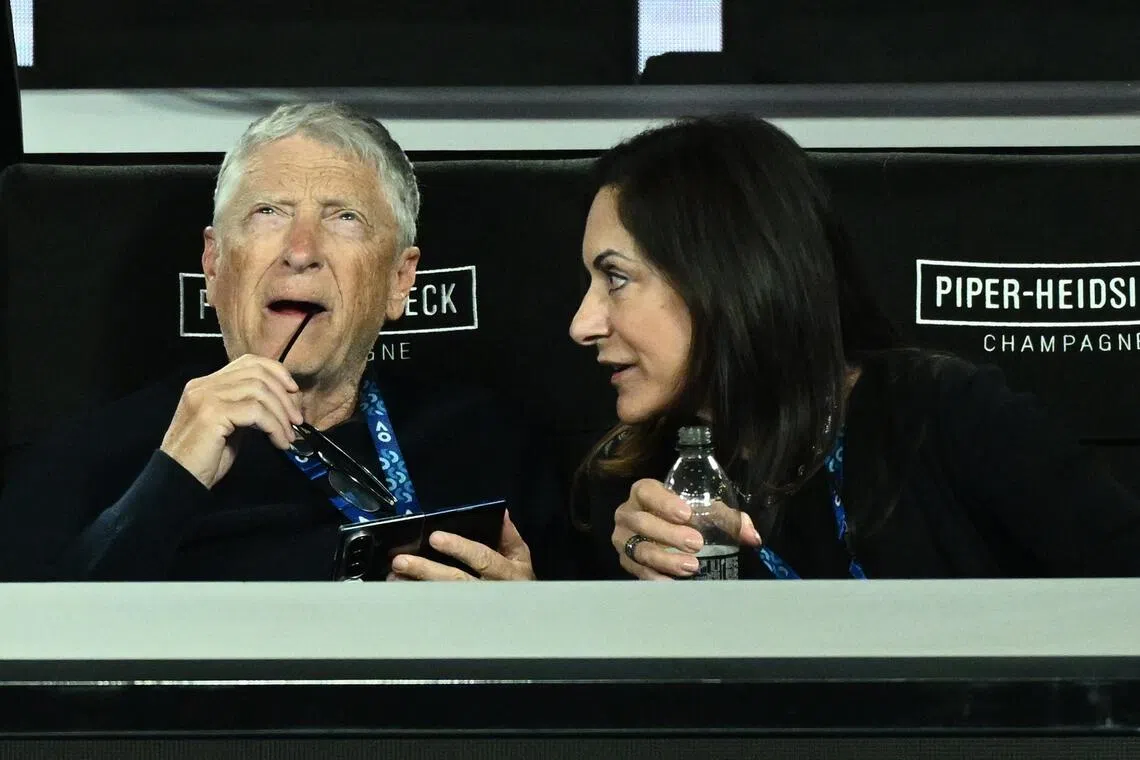 Bill Gates (left) with his partner Paula Hurd at the Australian Open tennis tournament in Melbourne on Jan 31, 2026. 
