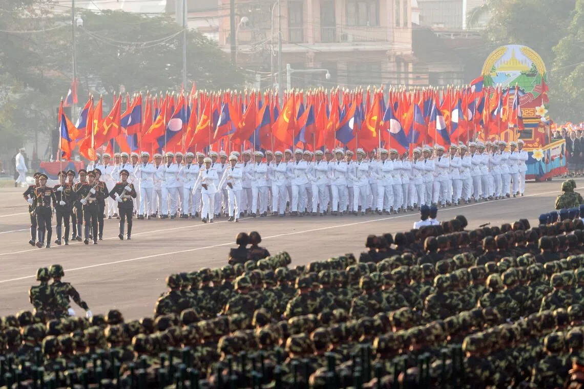 Laos military members taking part in a rehearsal in the run-up to the Dec 2 celebrations of 50 years of communist rule.