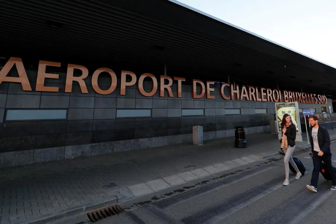 FILE PHOTO: Passengers arrive at Brussels South Charleroi Airport, Belgium, August 10, 2018. REUTERS/Yves Herman/File photo
