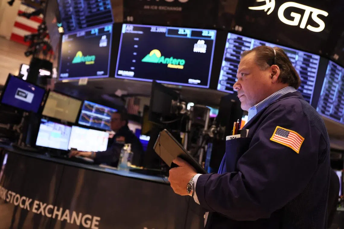 Traders work on the floor of the New York Stock Exchange in New York City.