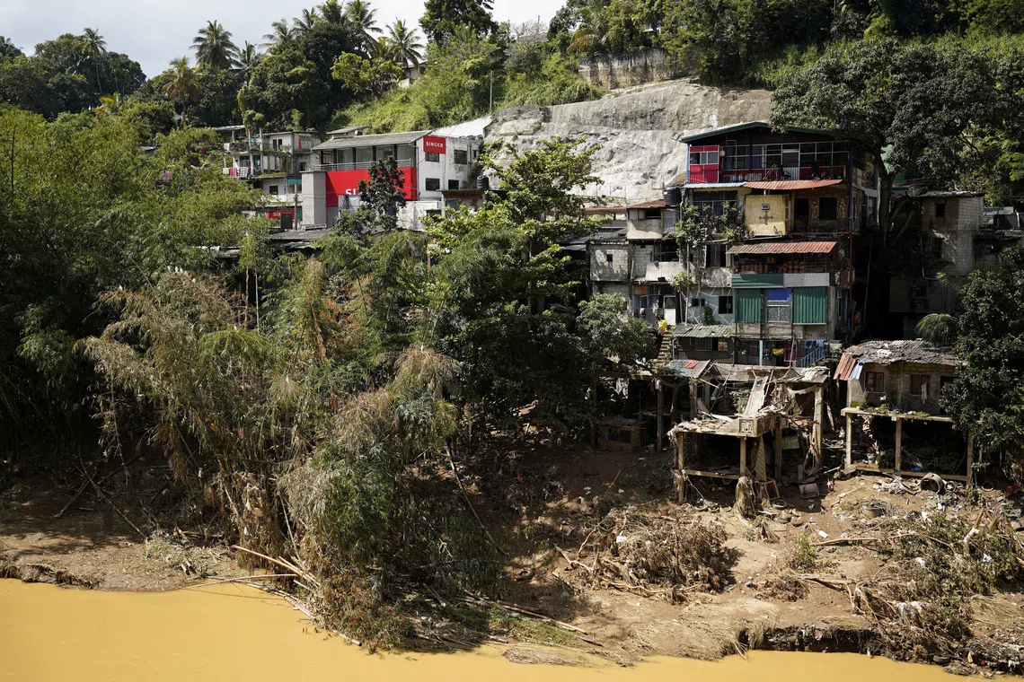 Houses damaged by the overflowing Mahaweli River following Cyclone Ditwah, in Kandy, Sri Lanka, December 4, 2025. REUTERS/Akila Jayawardena