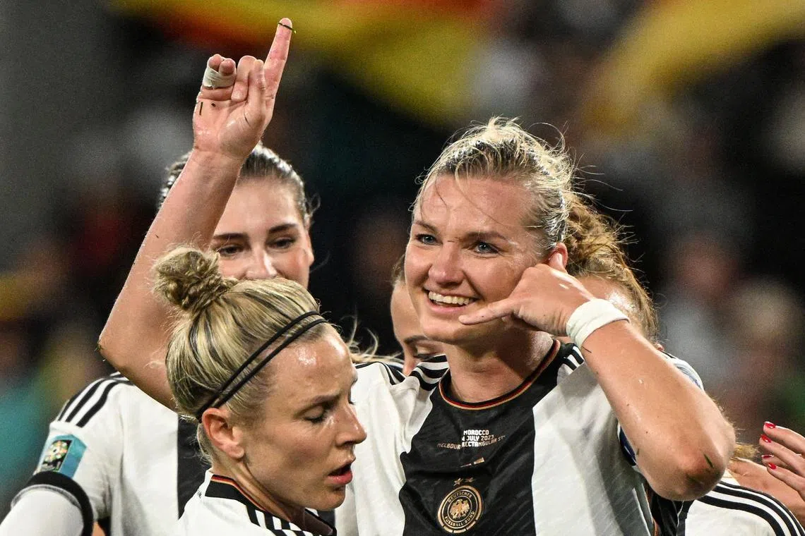 Germany's forward Alexandra Popp (right) celebrating with teammates after scoring her team's second goal during the Australia and New Zealand 2023 Women's World Cup Group H football match between Germany and Morocco at Melbourne Rectangular Stadium on Monday. She scored a hat-trick in Germany's 6-0 win.