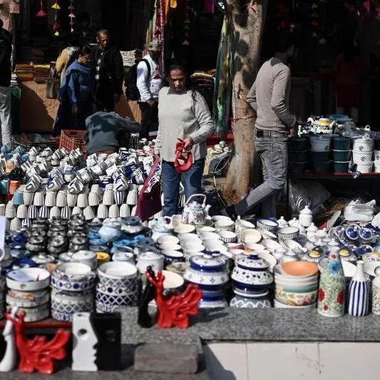 People shop ceramic crockery at a roadside market in New Delhi on Jan 12, 2026.