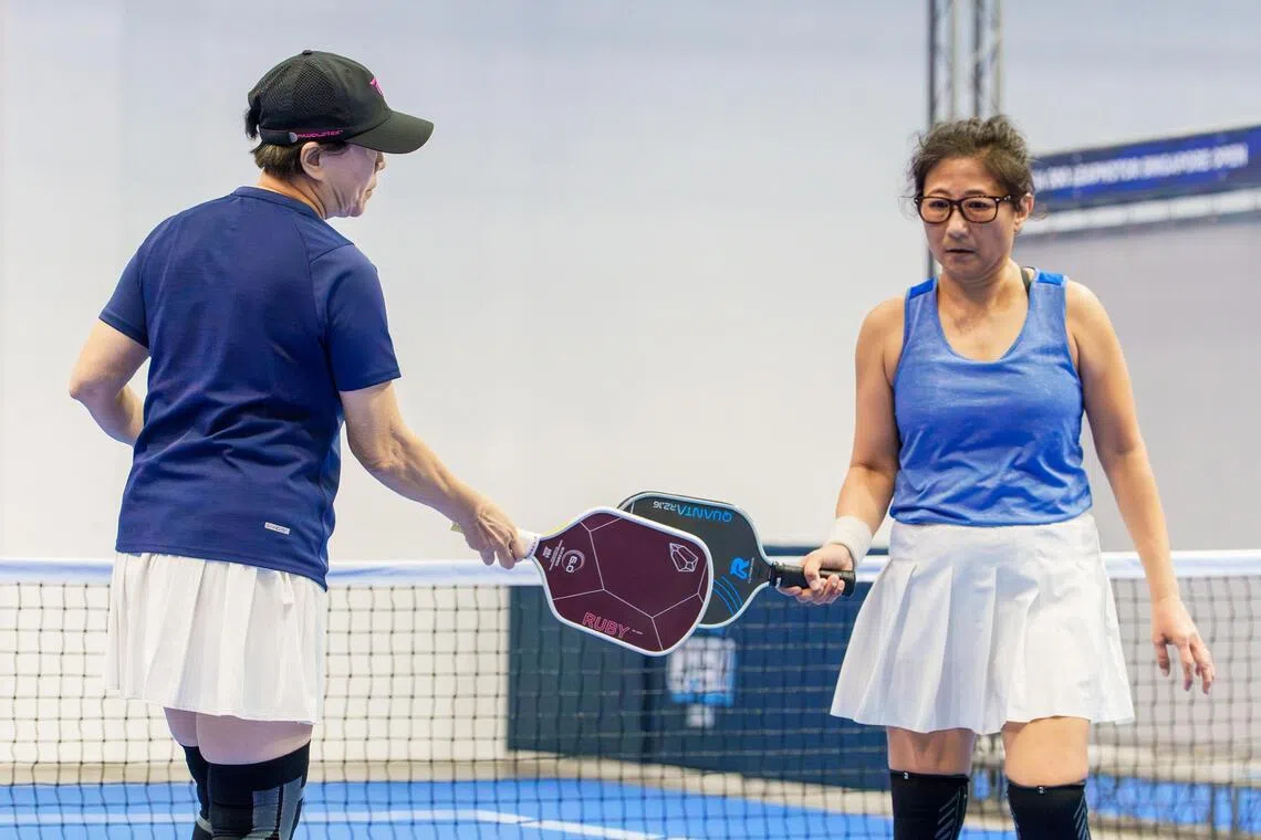 Seniors Brenda Lwa (left) and Shirly Tan competing at the amateur 50+ category of the Leapmotor Singapore Open.