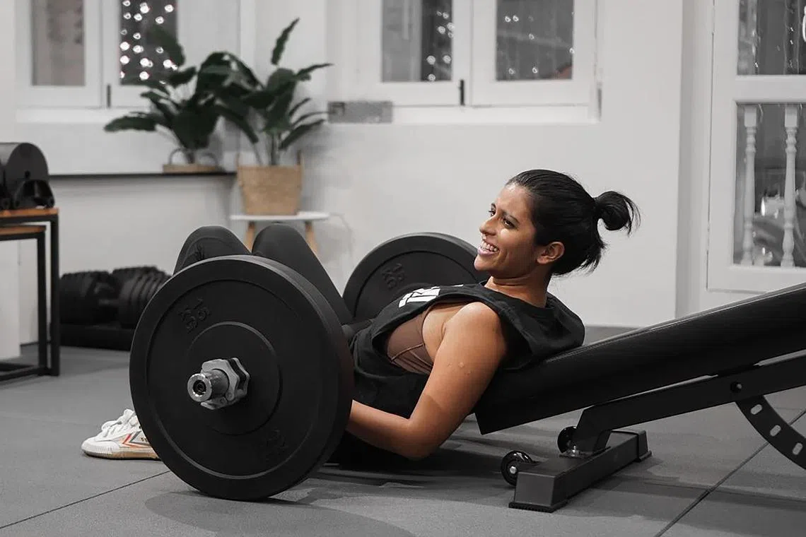 The writer, pictured here working out in the gym.