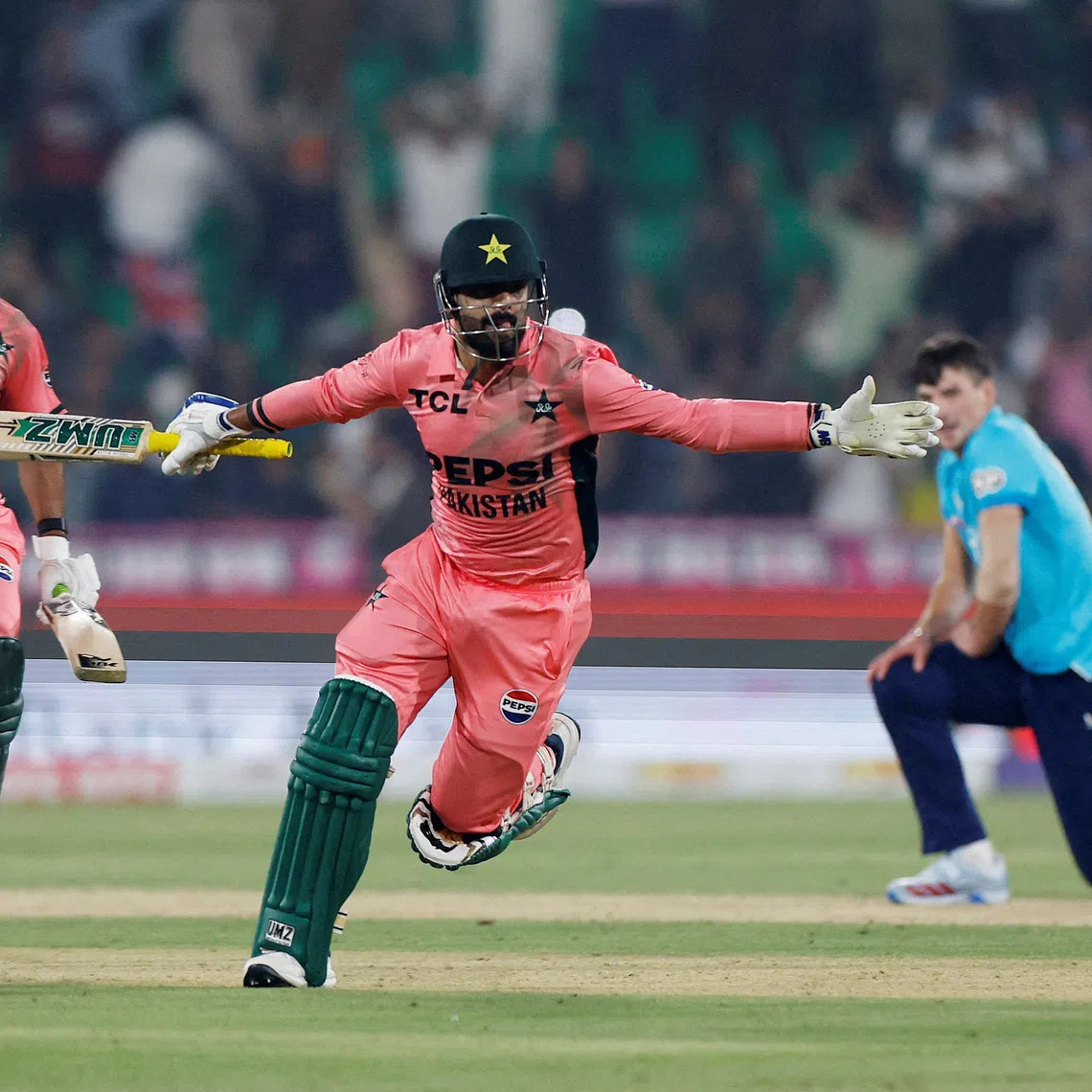 Cricket - Fourth One Day International - Pakistan v England - Gaddafi Stadium, Lahore, Pakistan - October 25, 2026  Pakistan's Haris Rauf and Pakistan's Shadab Khan celebrate after the match REUTERS/Akhtar Soomro     TPX IMAGES OF THE DAY