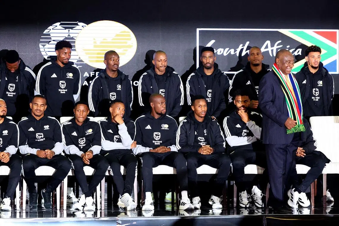 Soccer Football -FIFA World Cup 2026 - South Africa coach Hugo Broos announces his World Cup squad - Sefako Makgatho Presidential Guest House, Pretoria, South Africa - May 27, 2026  South Africa president Cyril Ramaphosa with the squad during the announcement REUTERS/Siphiwe Sibeko