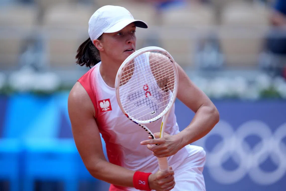FILE PHOTO: Aug 2, 2024; Paris, France; Iga Swiatek (POL) returns a shot against Anna Karolina Schmiedlova (not pictured) in the bronze medal match during the Paris 2024 Olympic Summer Games at Stade Roland Garros. Mandatory Credit: Amber Searls-USA TODAY Sports/File photo