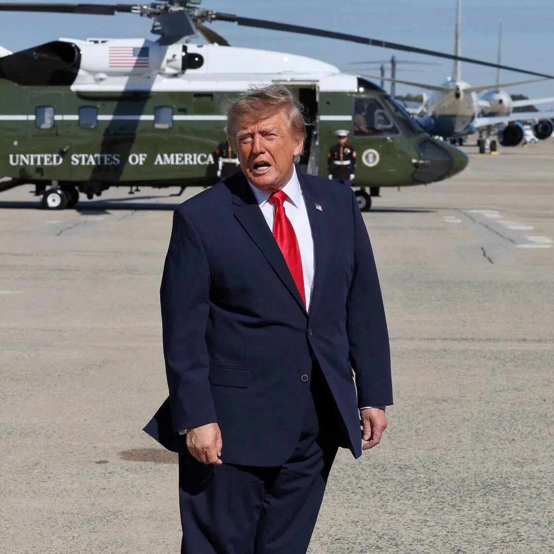 US President Donald Trump speaking to reporters before boarding Air Force One on Oct 23.